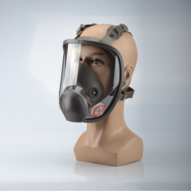 Full-face protective mask on a mannequin head against a light gray background