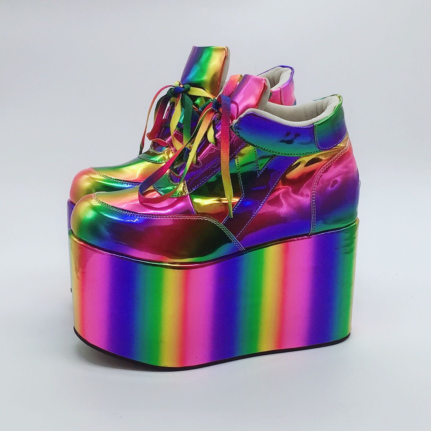 Multicolored platform shoe on a light gray background