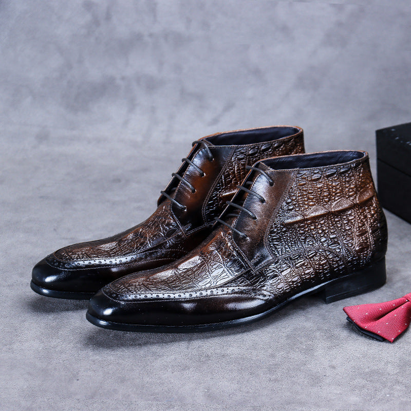 Brown leather dress shoes with textured design on a gray surface, accompanied by a red pocket square.