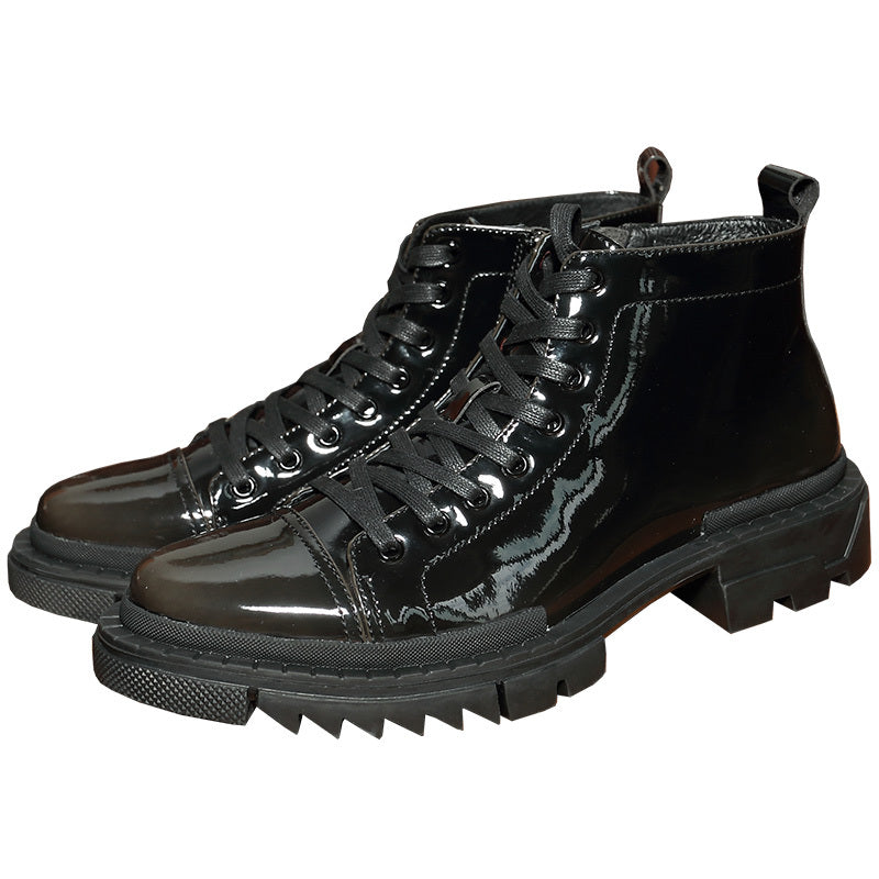 Black patent leather boots with thick soles on a white background