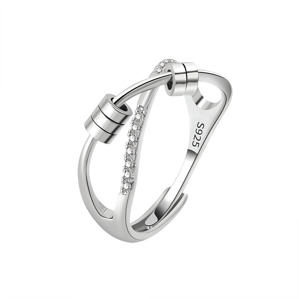 Silver ring with small diamonds on a white background