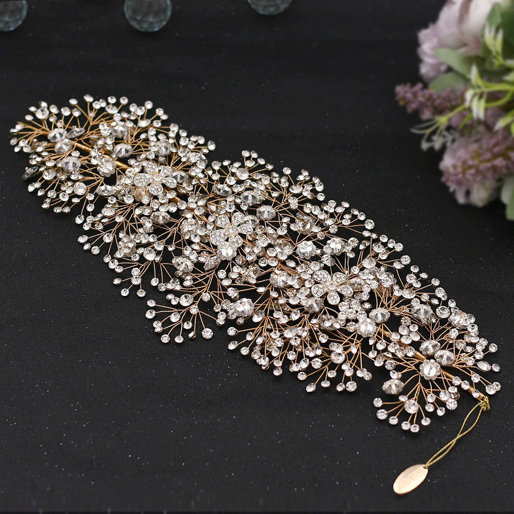 Decorative headband with pearls and crystals on a black background