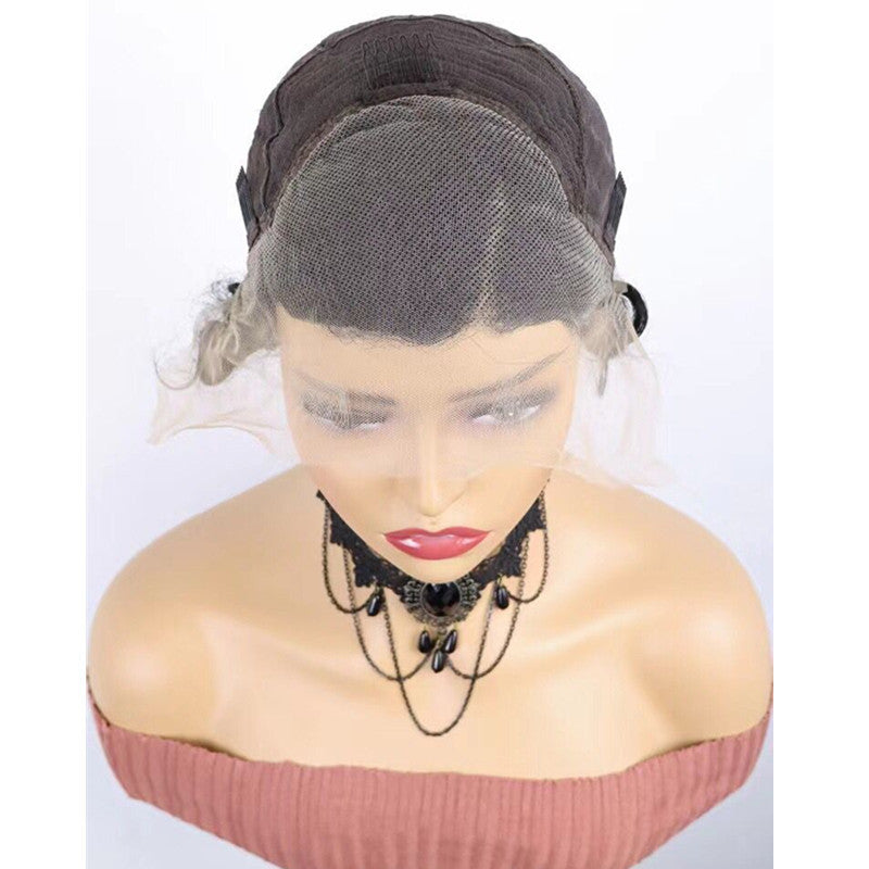 Mannequin head with a wig and lace front on a white background