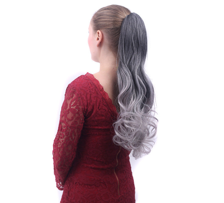Woman wearing a gray ponytail extension on a white background