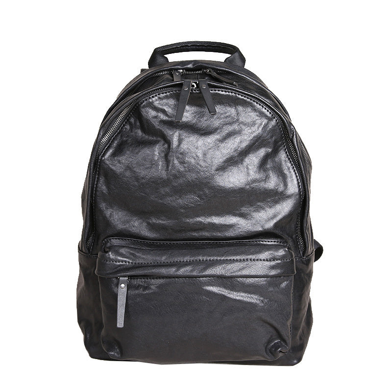 Black leather backpack on a white background