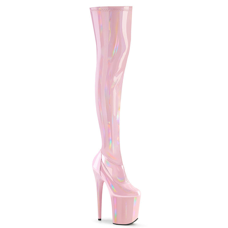 Pink platform boots with a white background