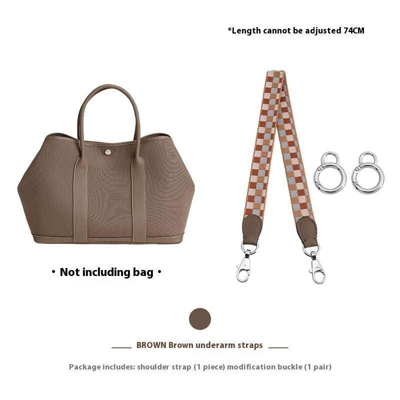 Brown handbag with a checkered strap and buckles on a white background