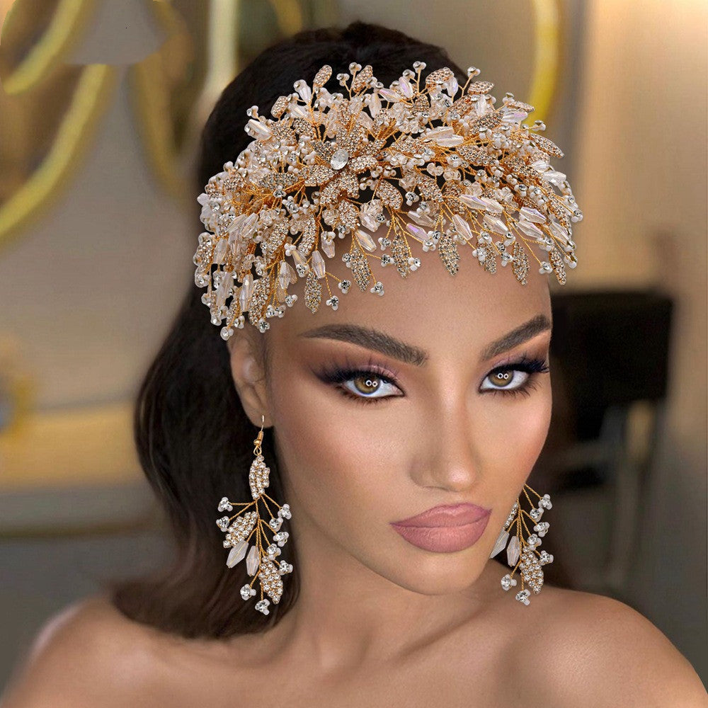 Woman wearing an elaborate headpiece and earrings with a blurred background