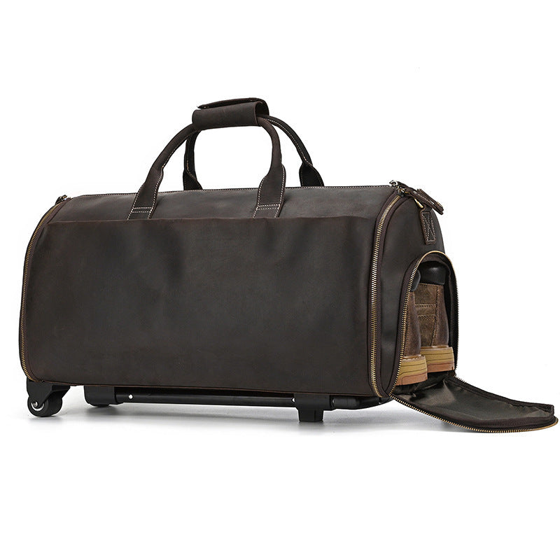 Brown leather duffel bag with wheels on a white background