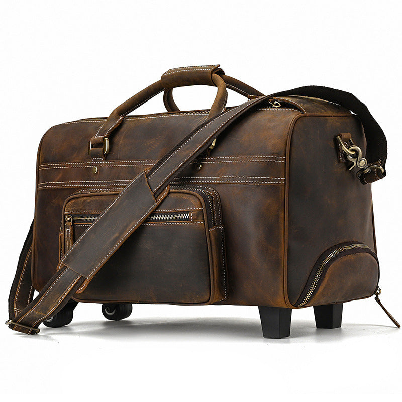 Brown leather travel bag with wheels on a white background