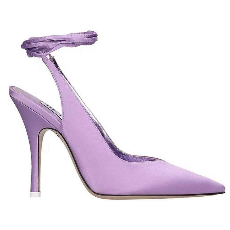 Purple high-heeled shoe with ankle strap on a white background