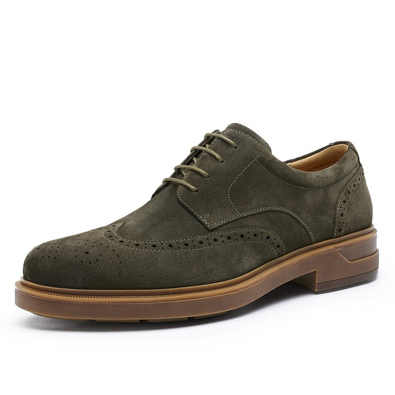 Green suede dress shoe with brown sole on a white background
