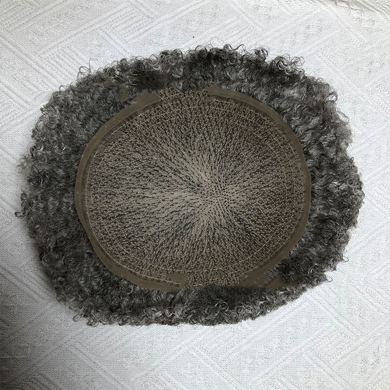 Round textured mat with a central circular design on a white textured surface