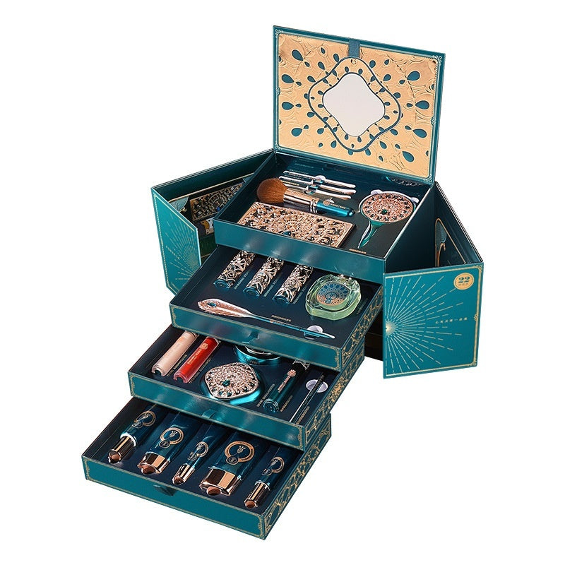 Open jewelry box with various jewelry items on a white background