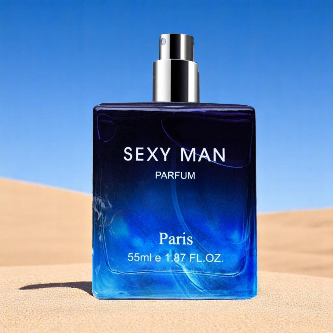 Perfume bottle labeled 'Sexy Man Parfum' on sand with blue sky background