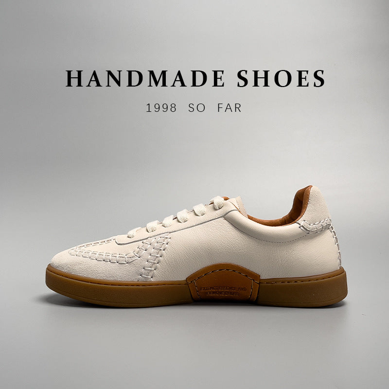 White sneaker with brown accents on a gray background, featuring the text 'Handmade Shoes 1998 So Far'.