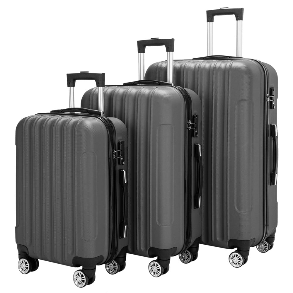 Set of three gray suitcases with wheels on a white background