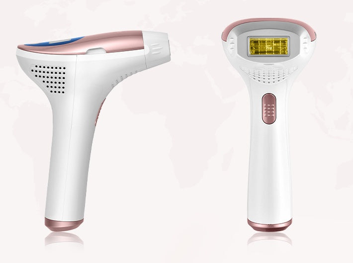 Two white and rose gold hair removal devices on a white background