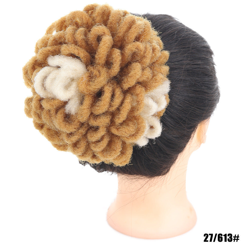 Mannequin head with a textured brown and white headband on a white background