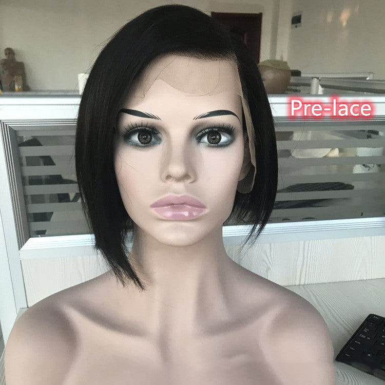 Mannequin head with black hair and makeup in a room setting