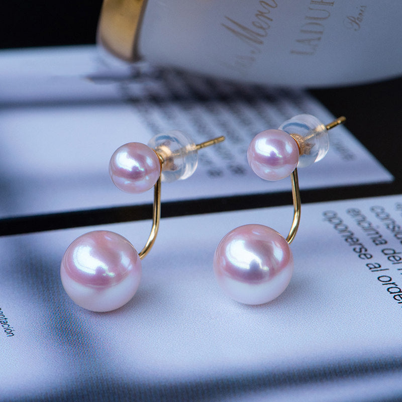 Pearl earrings on a magazine page