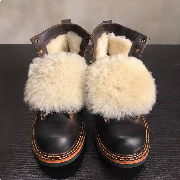 Black shoes with white fur on a dark surface