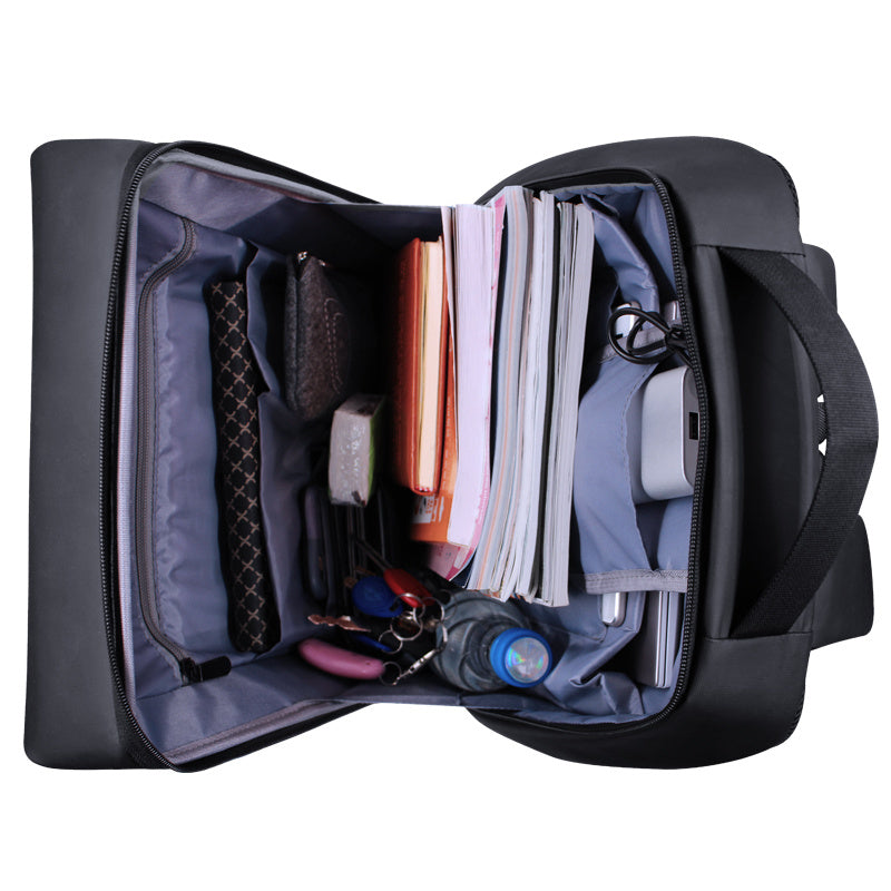 Black backpack with compartments containing various items on a white background