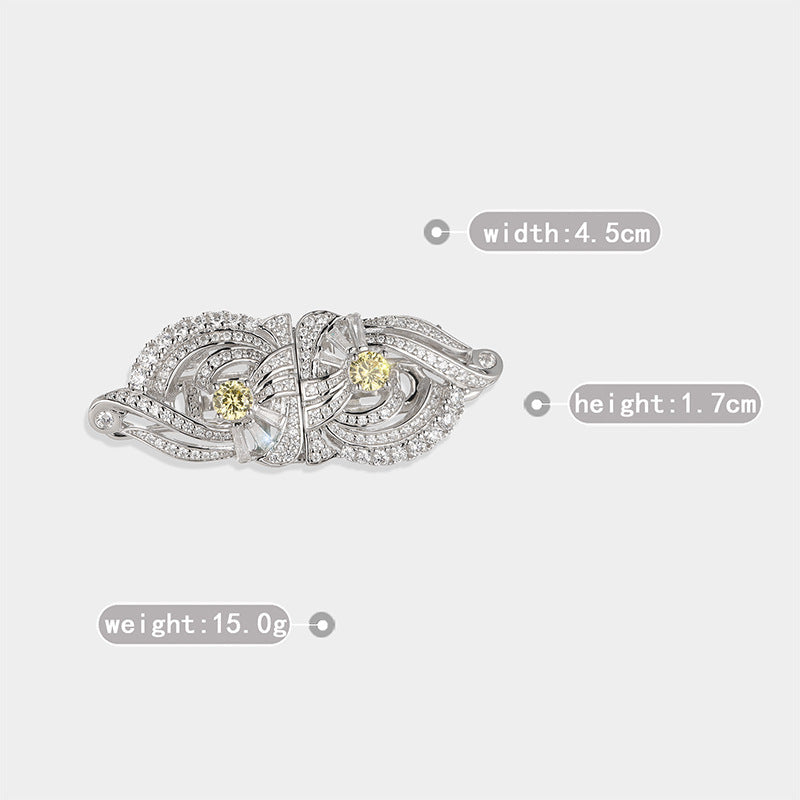 Silver ring with gemstones on a light gray background