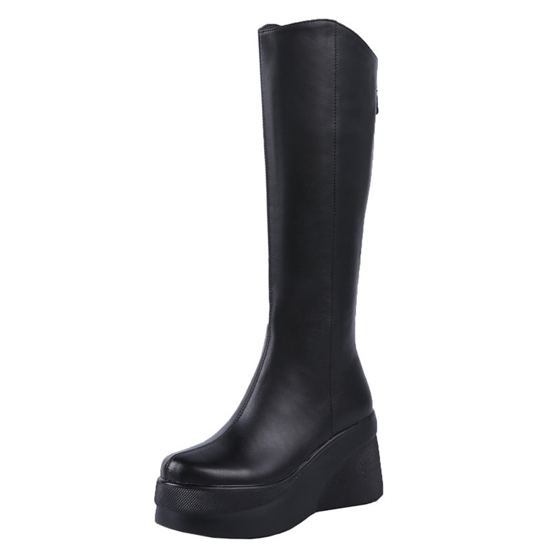 Black knee-high boot on a white background