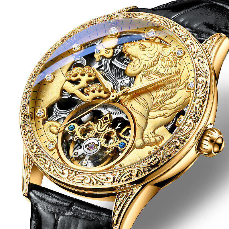 Luxury gold watch with intricate design and black strap
