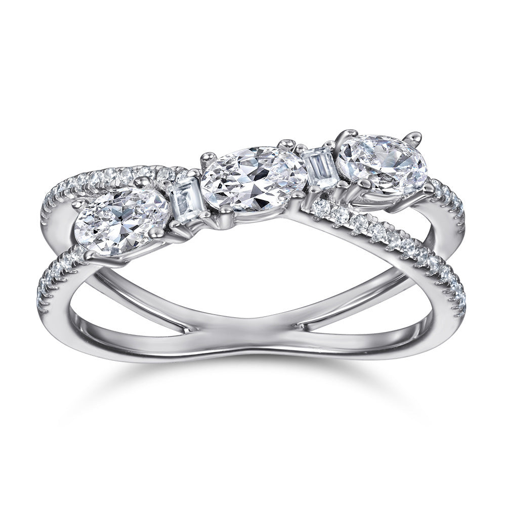 Diamond ring with multiple stones on a white background