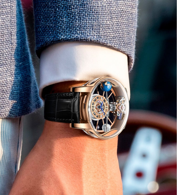 Luxury watch on a person's wrist with a blurred background