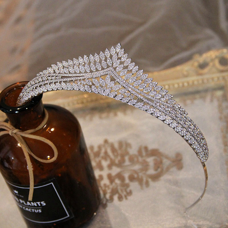 Silver tiara on a bottle labeled 'Plants' with a textured background