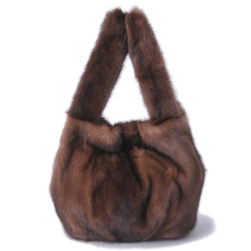 Brown fur handbag on a white background
