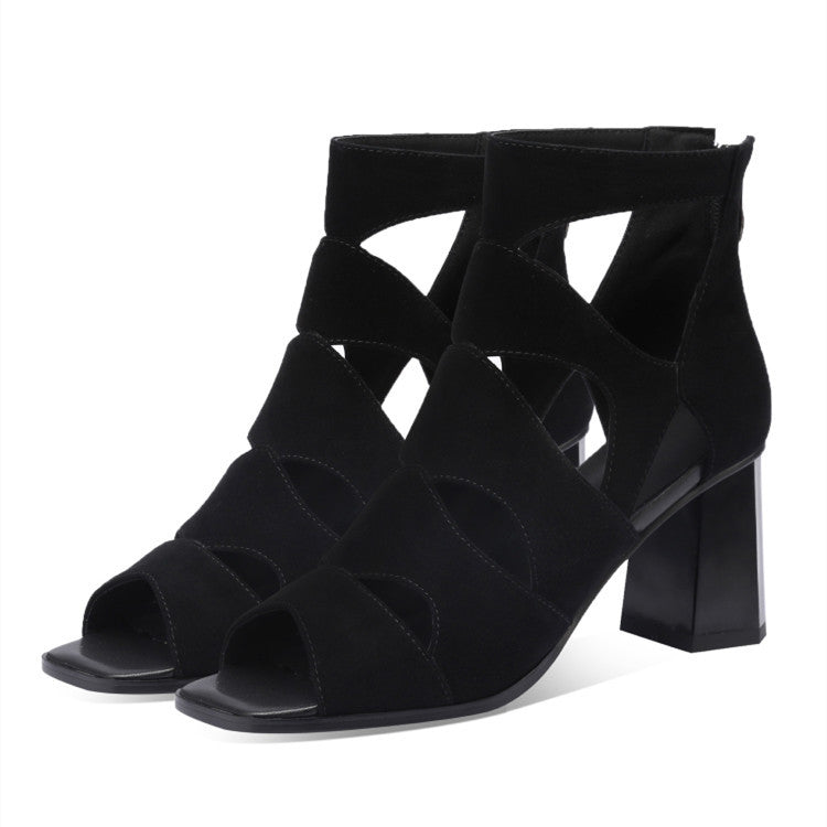Black suede open-toe sandals with block heels on a white background
