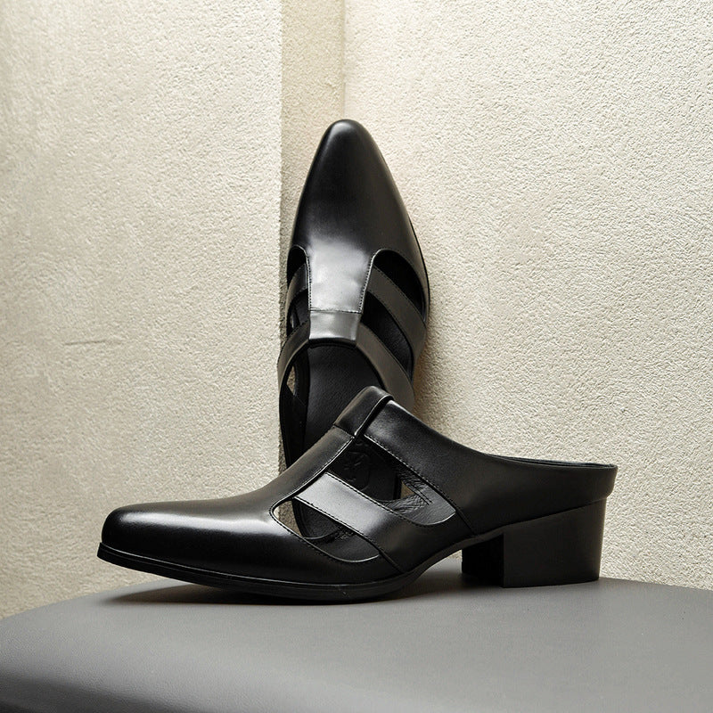 Black high-heeled shoes with cut-out design on a neutral background
