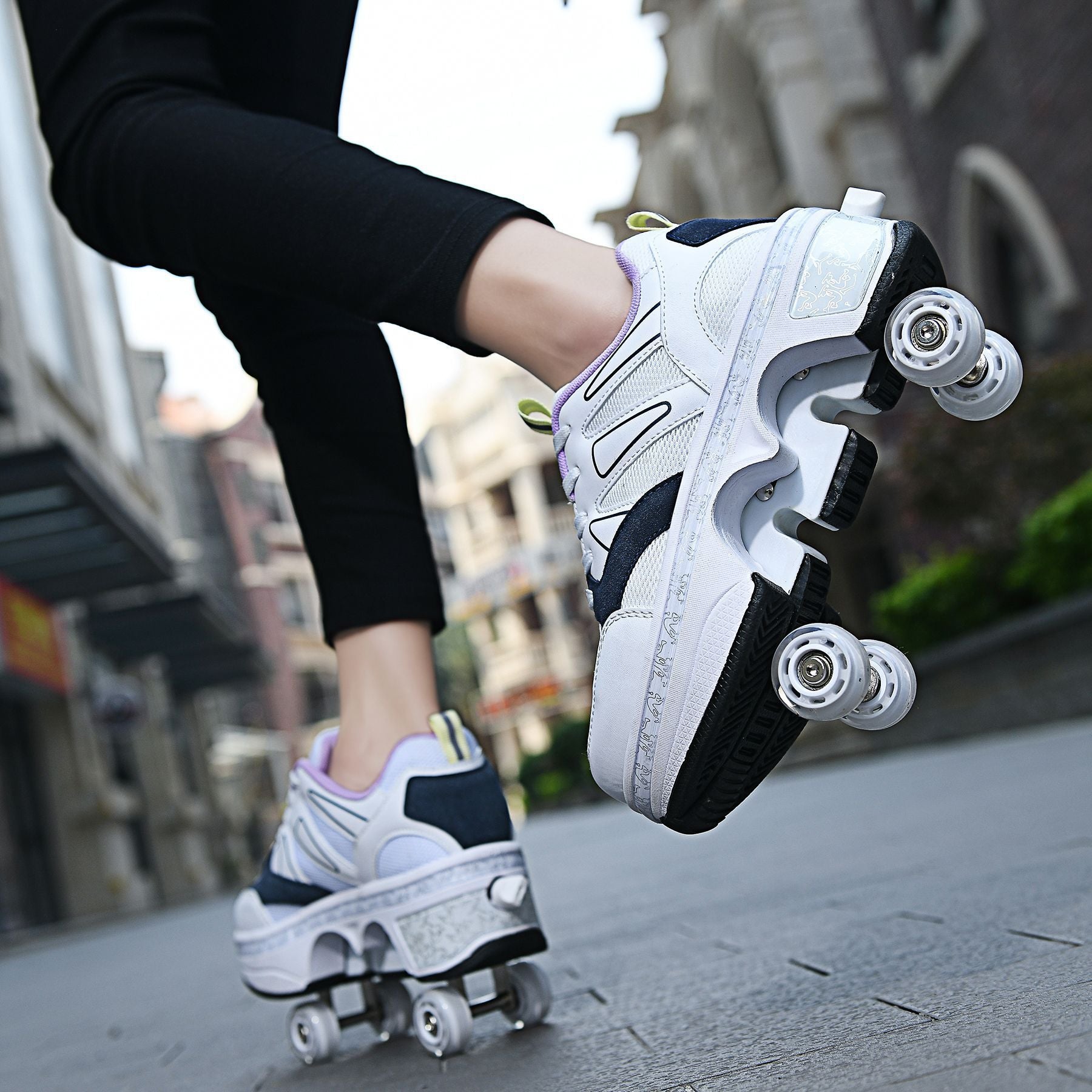Person wearing white roller shoes with visible wheels on a blurred street background