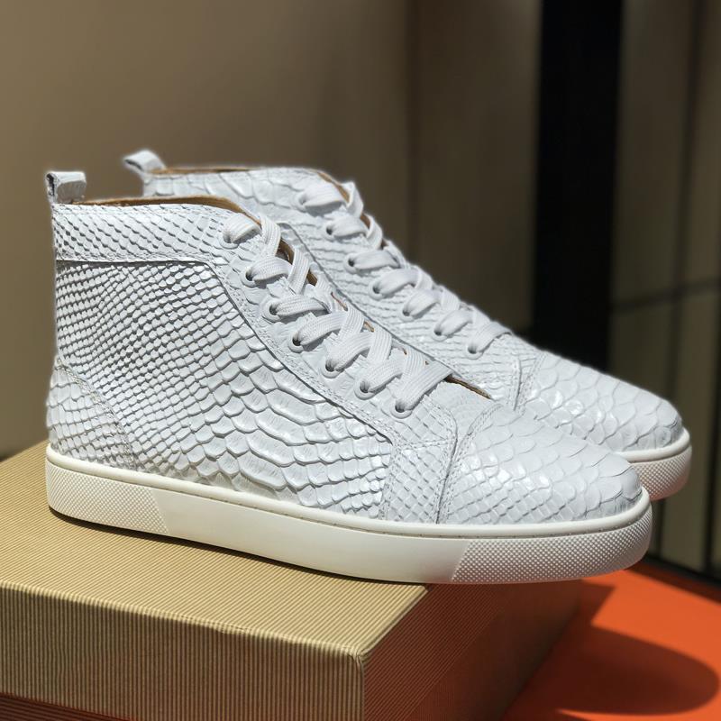 White high-top sneaker with snake skin pattern on a box