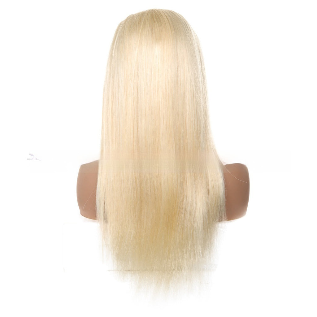 Blonde wig on a mannequin head with a white background