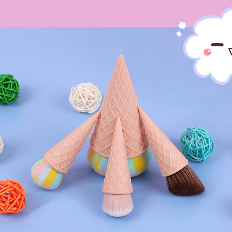 Ice cream cone-shaped makeup brushes on a colorful background with decorative items.