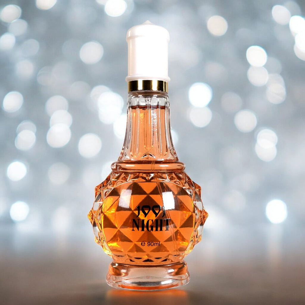 Perfume bottle labeled '99.9 Night' on a blurred background