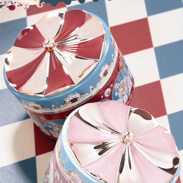 Decorative tumblers with floral patterns on a checkered background