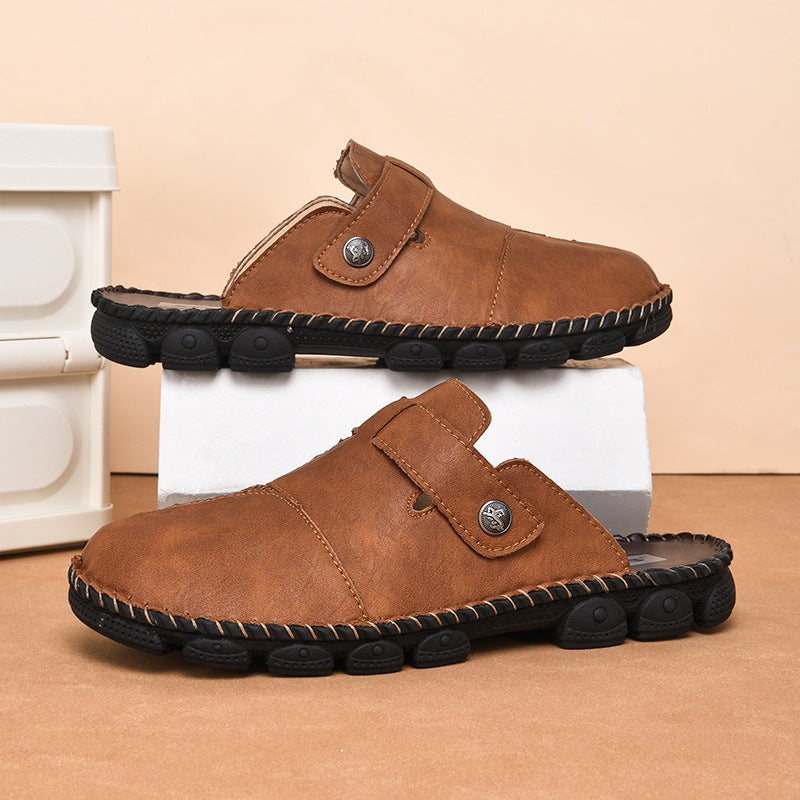 Brown slippers with black soles on a beige background