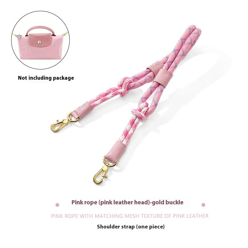 Pink shoulder strap with gold buckle on a white background