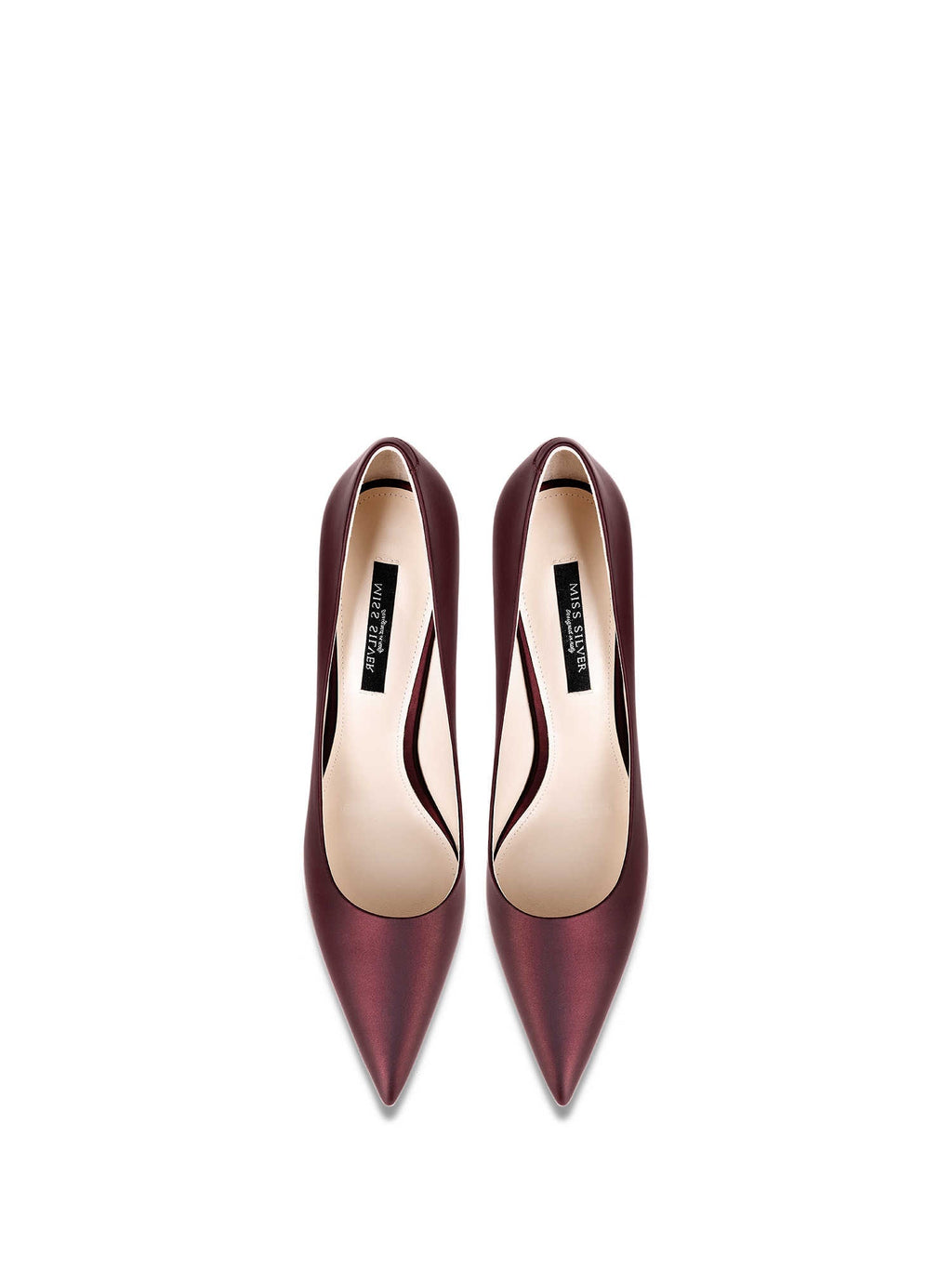 Pair of maroon high-heeled shoes on a white background