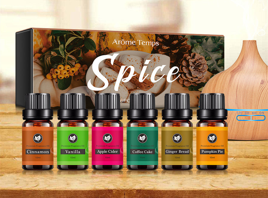 16 Theme Atmosphere Flameless Essential Oil Sets with six autumn-inspired essential oil bottles displayed on a wooden surface.