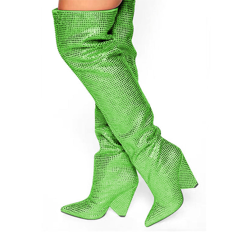 Green fishnet knee-high stockings on a white background