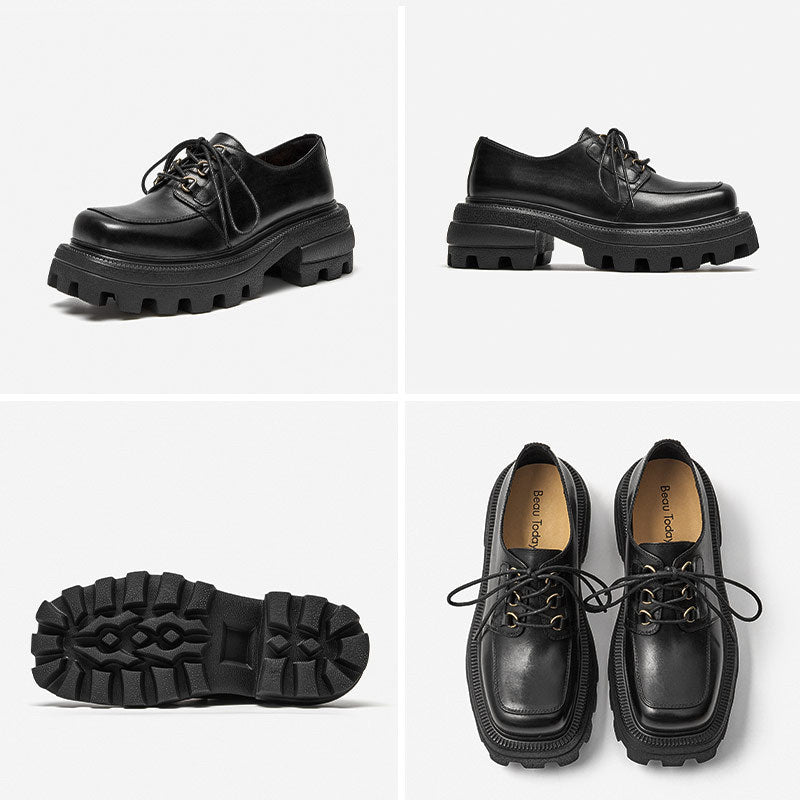 Black leather shoes with thick soles on a white background