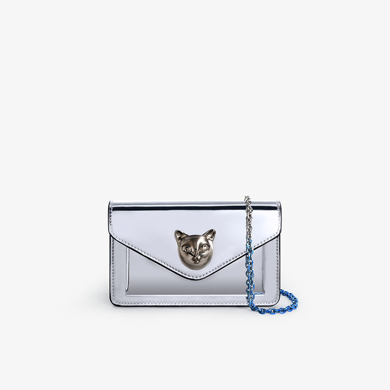 Silver clutch bag with cat face design on a white background