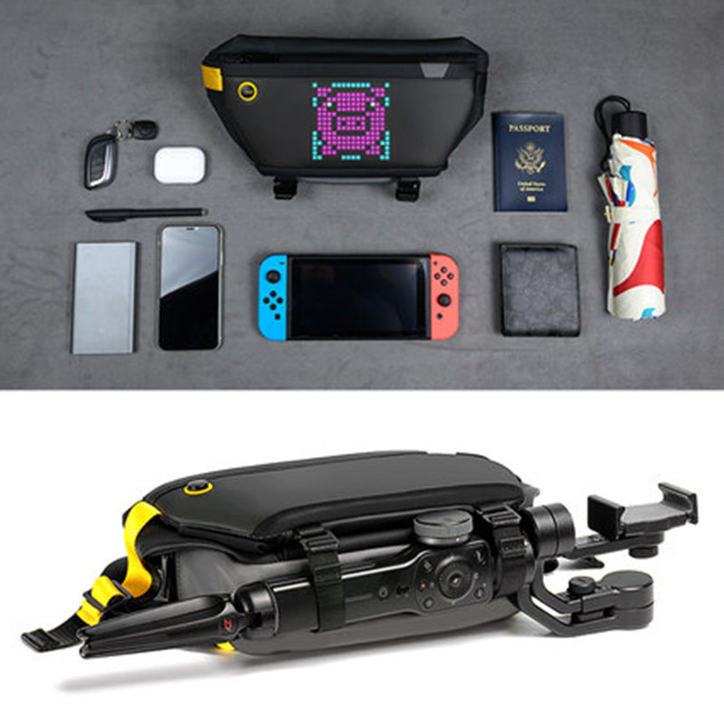 Collection of electronic devices and travel items on a gray surface